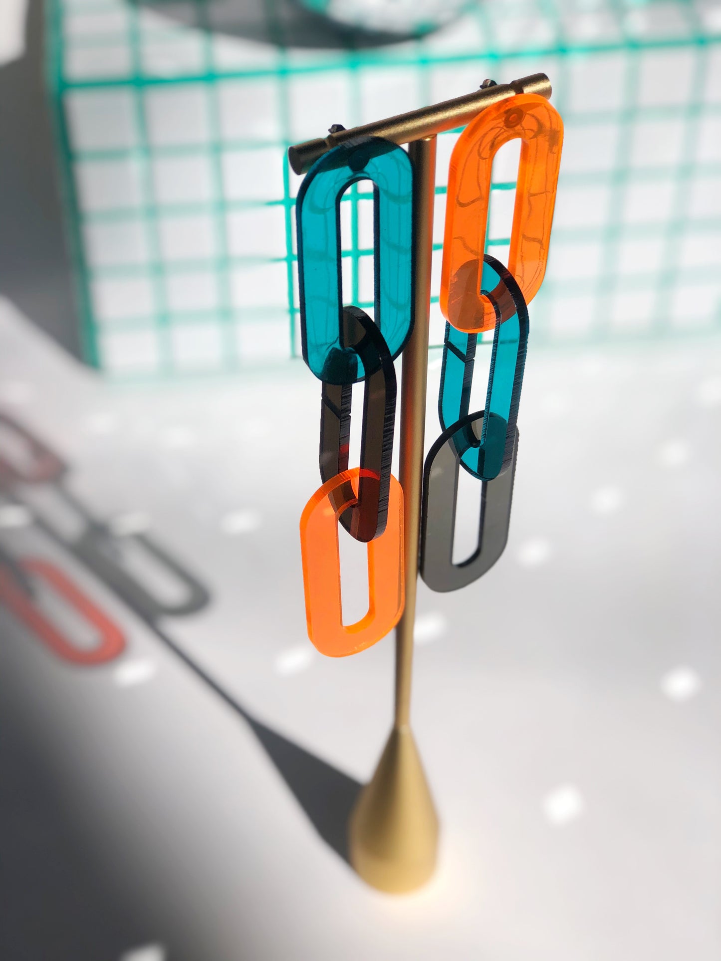 The Spano in Smoky Brown, Teal, + Neon Orange Acrylic