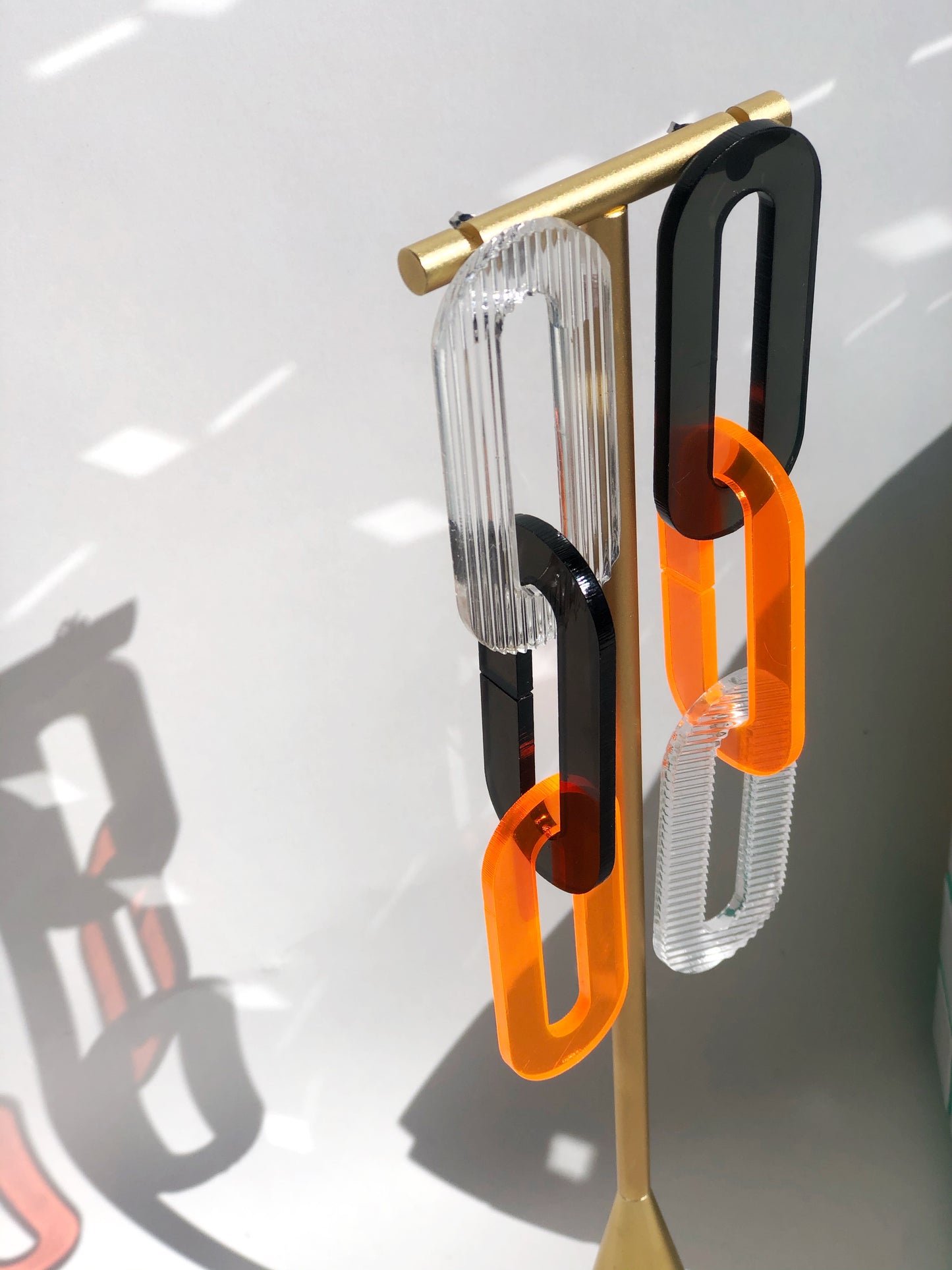 The Spano in Smoky Brown, Neon Orange, + Clear Ribbed Acrylic