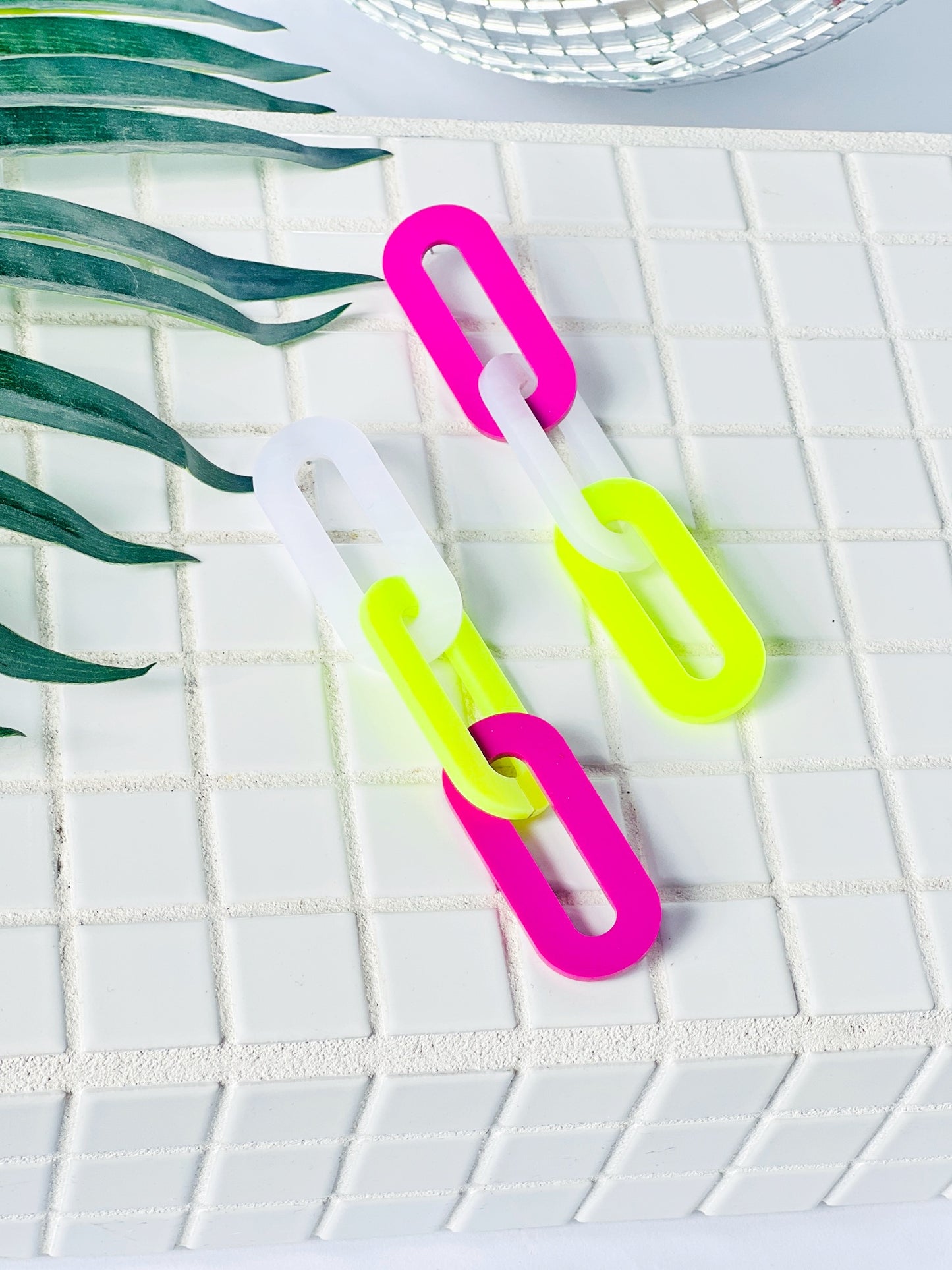 The Spano Earring in Frosted Lime, Marbled White, and Raspberry Acrylic